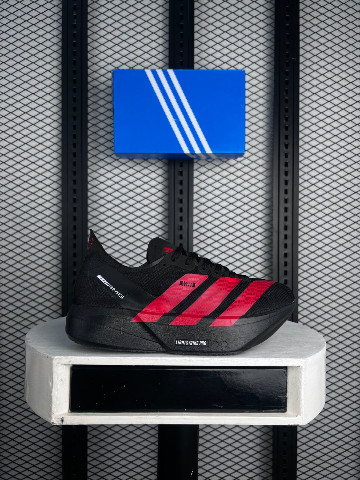 Matte black mesh runner with bright red graphic accents