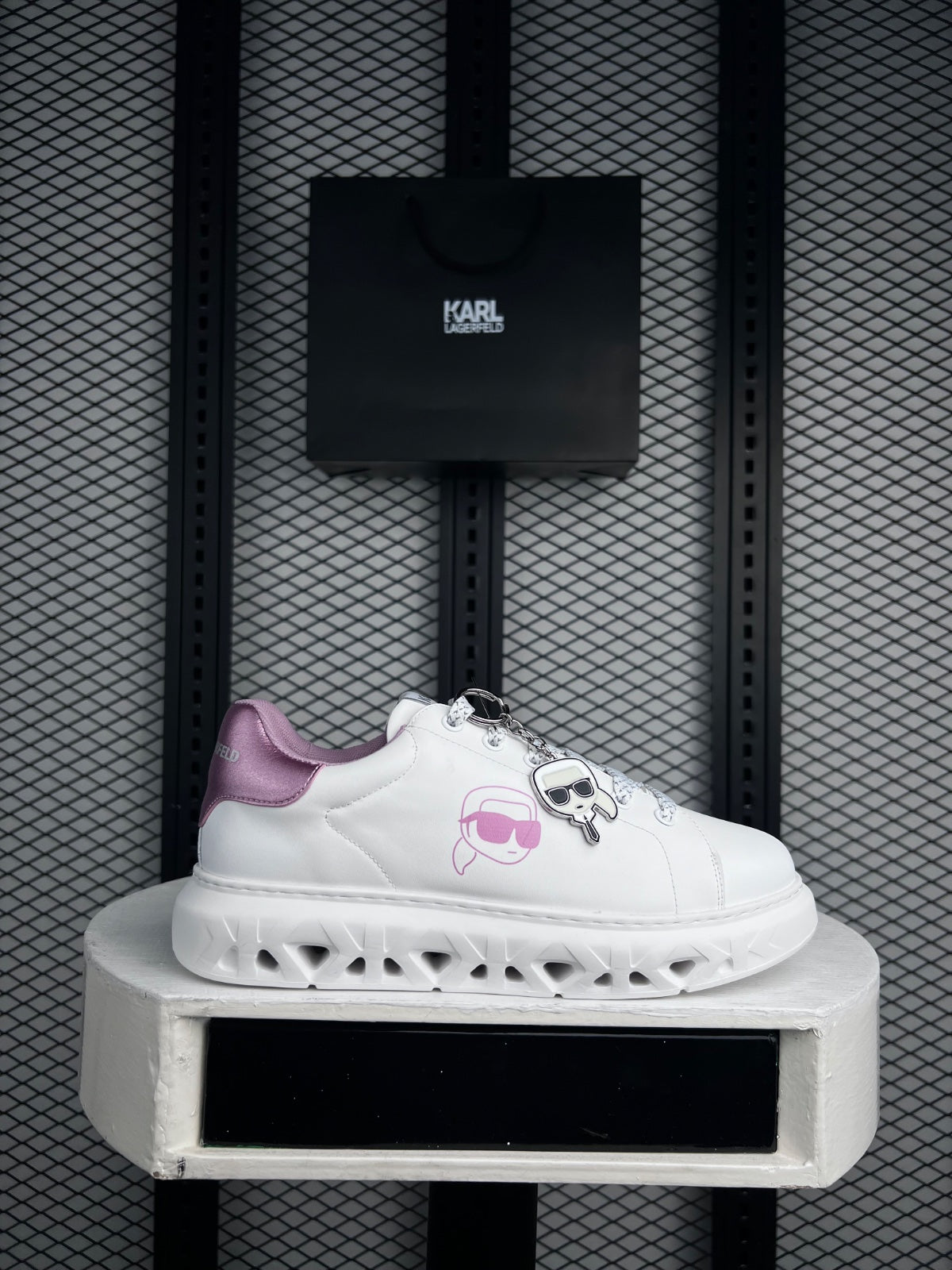 Chunky platform silhouette in white with metallic pink heel