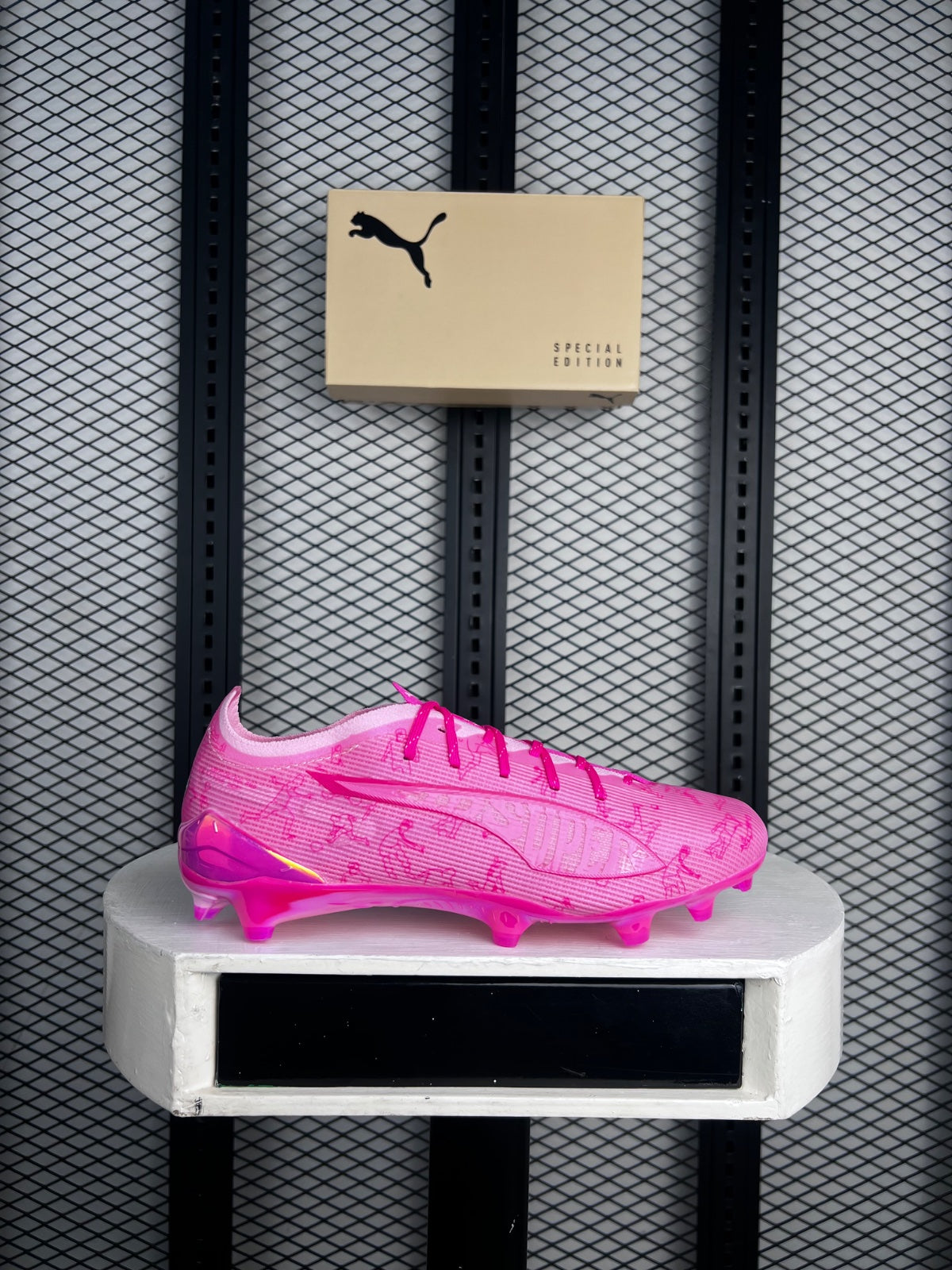 Translucent-stud knit football boot in graphic pink