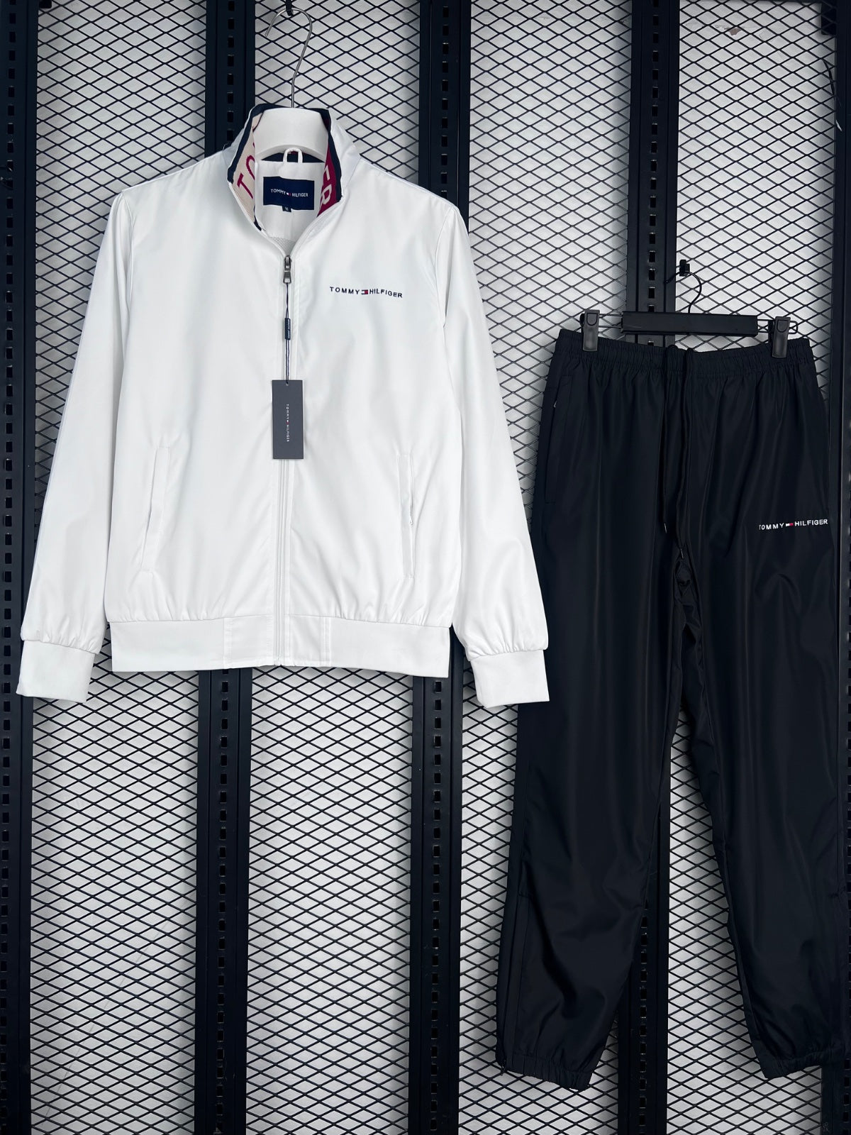 White zip-front jacket and black track pants set