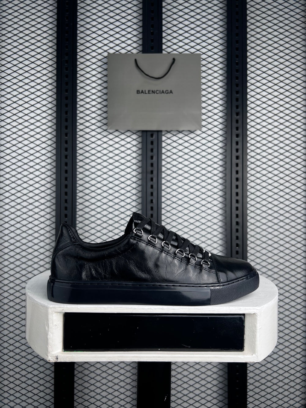 Black wrinkled leather low-tops with metal D-rings