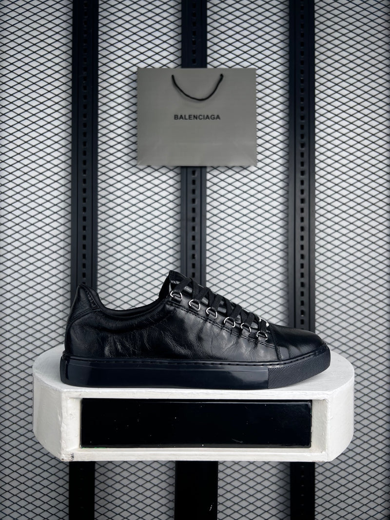 Black wrinkled leather low-tops with metal D-rings