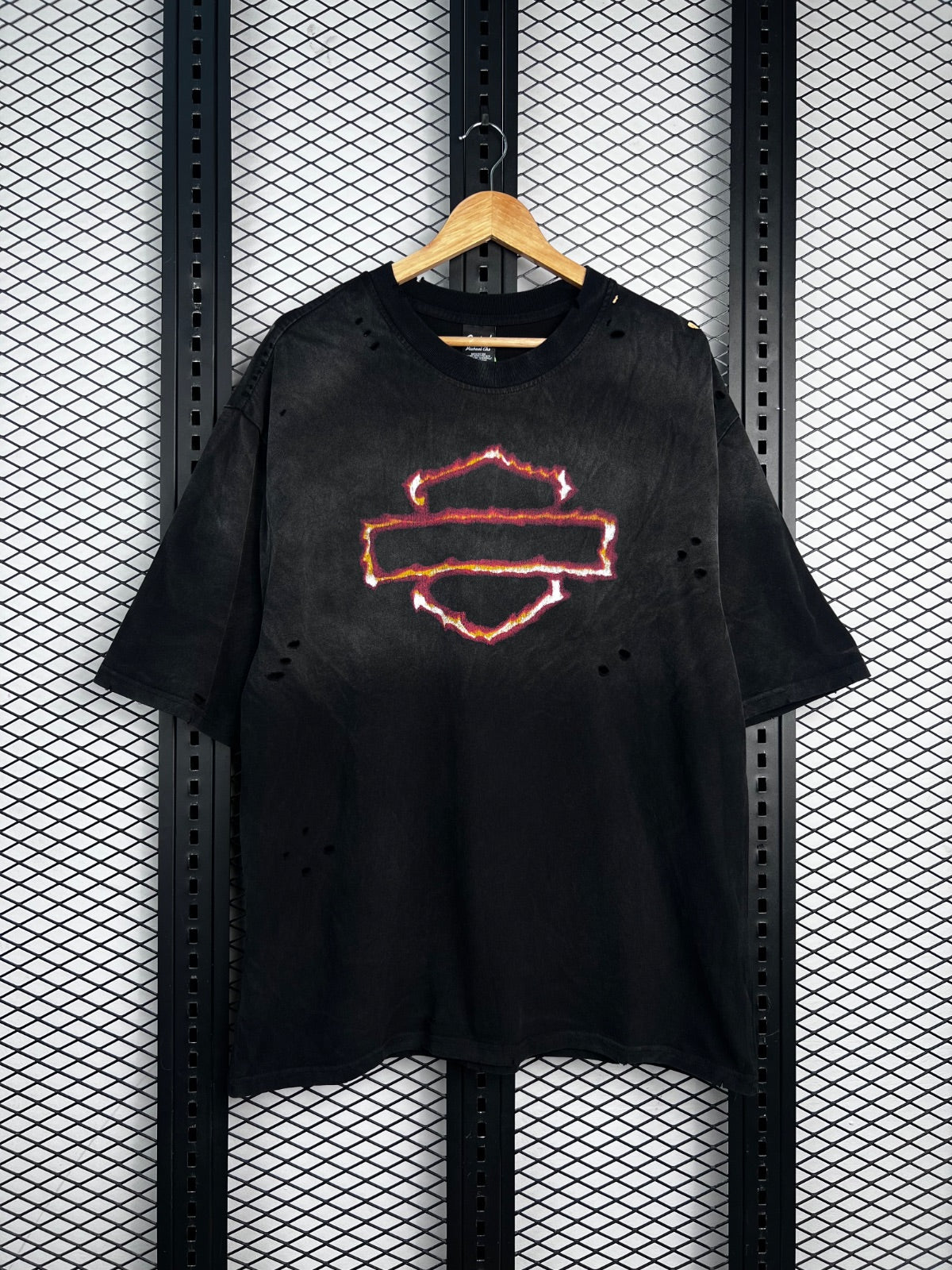 Crewneck silhouette in faded black with distressed flaming emblem