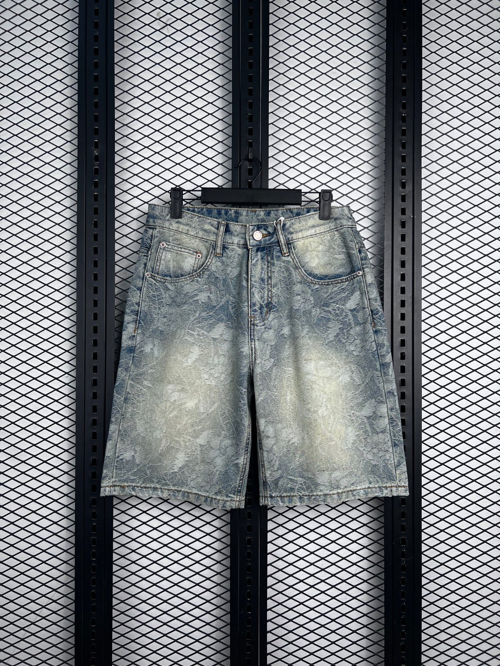 Acid-wash floral-etched denim shorts in light blue