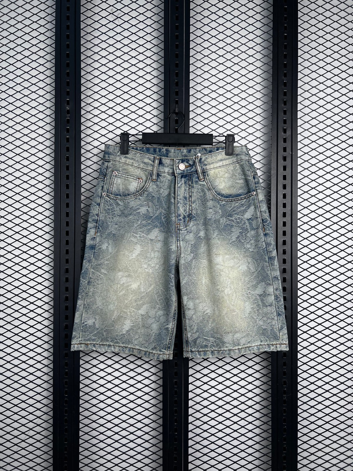 Acid-wash floral-etched denim shorts in light blue