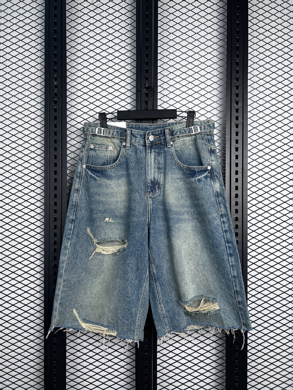 Denim distressed jorts with buckle waist detail