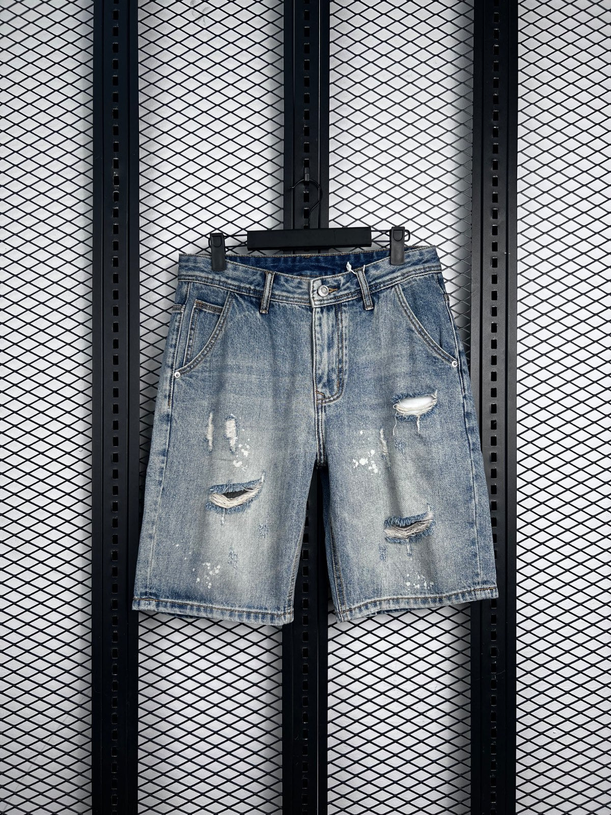 Acid-wash light blue distressed denim shorts