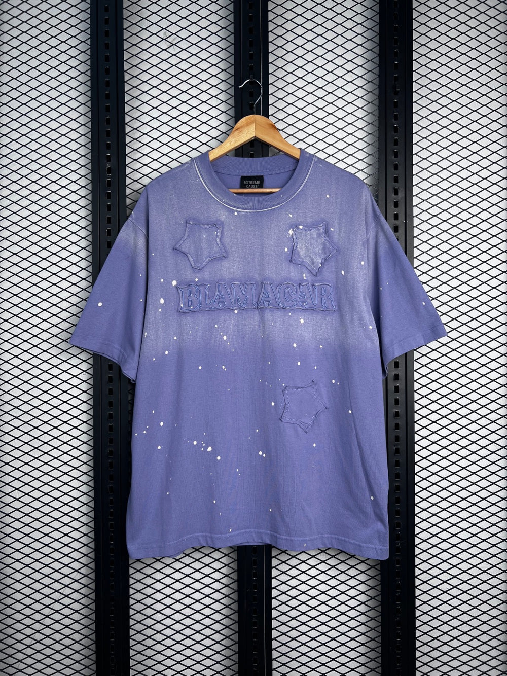 Washed cotton crewneck with embossed stars and paint splatter