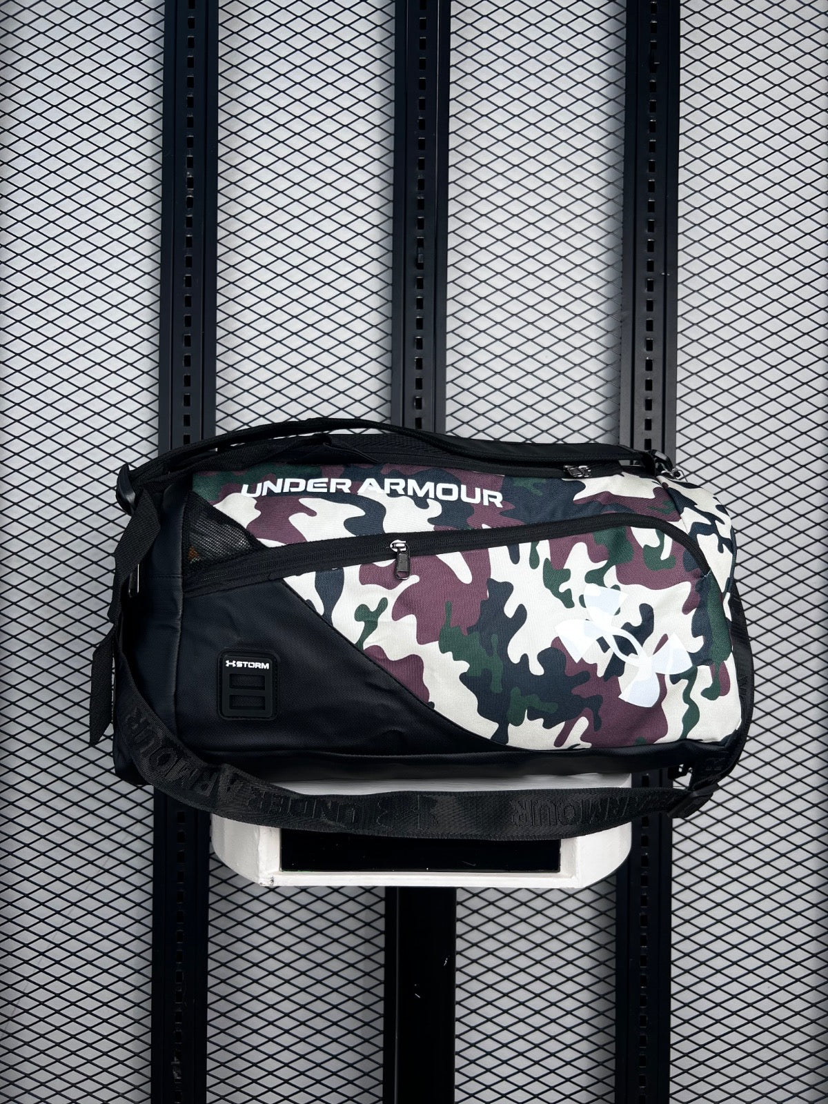 Asymmetric-zip canvas sports bag in woodland camo
