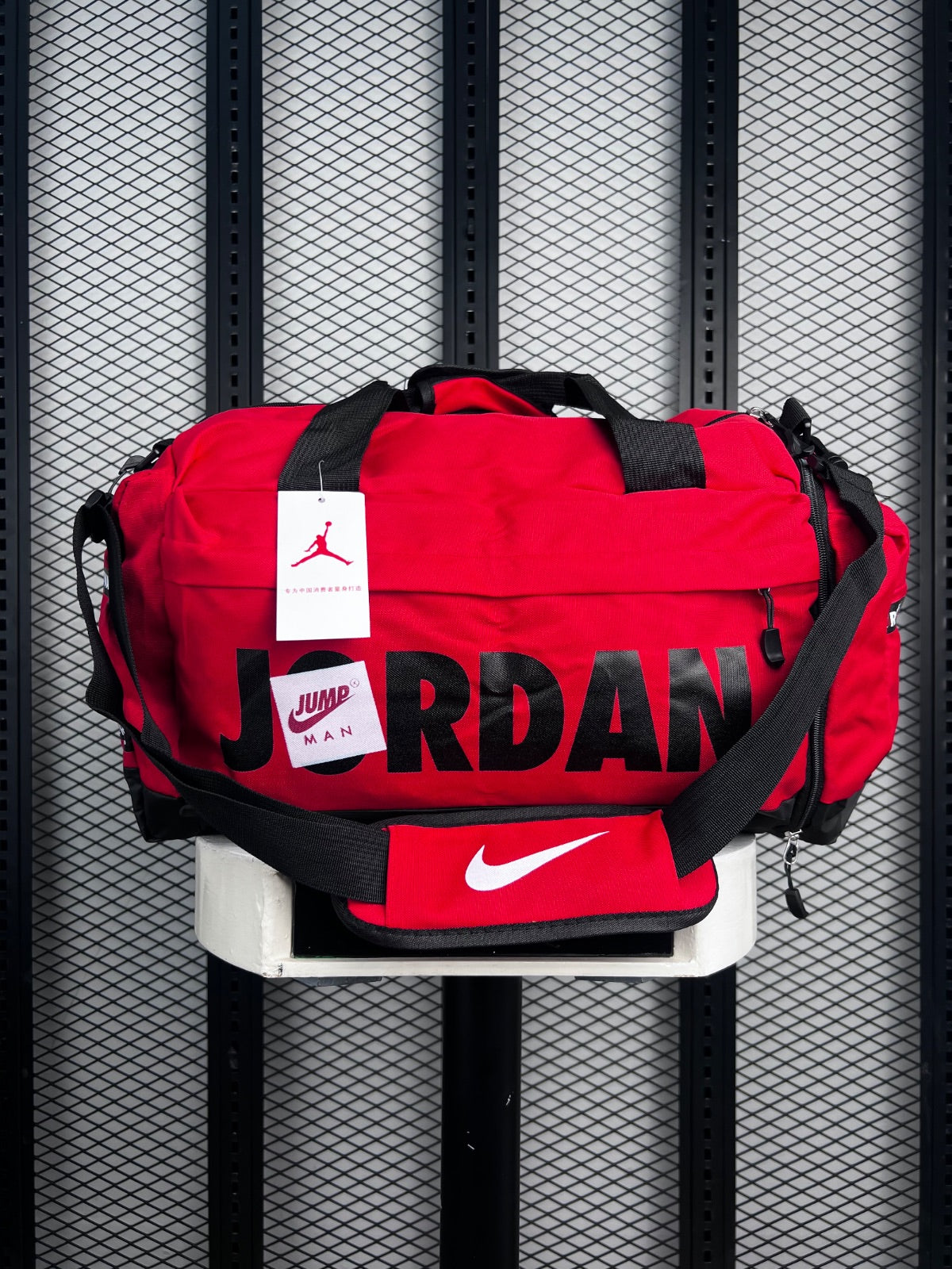 Webbed-strap canvas duffle in red and black