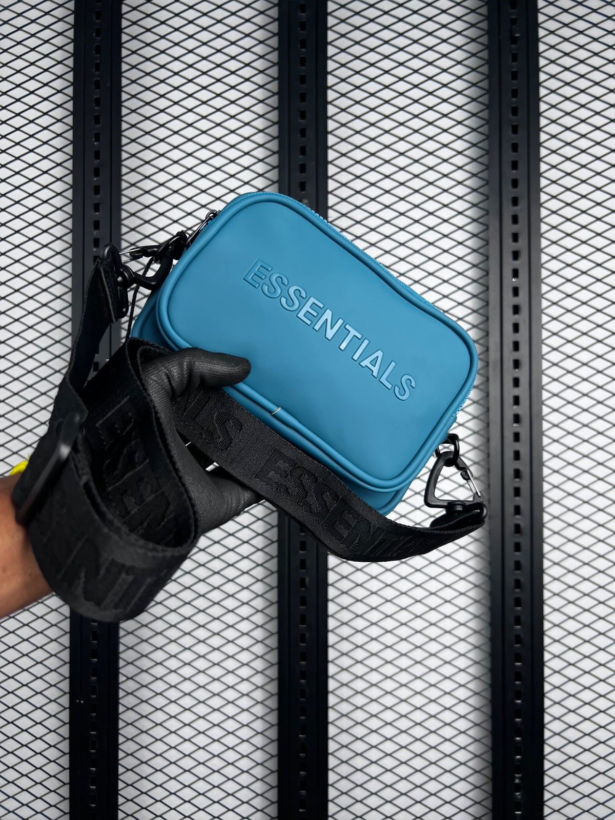 Dusty teal rubberised crossbody pouch with black strap