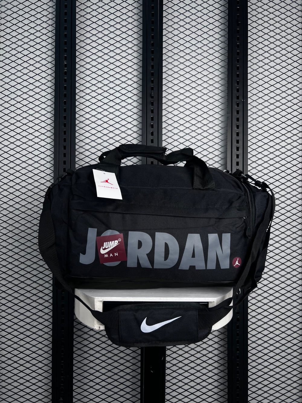 Duffel bag silhouette in black with grey typography