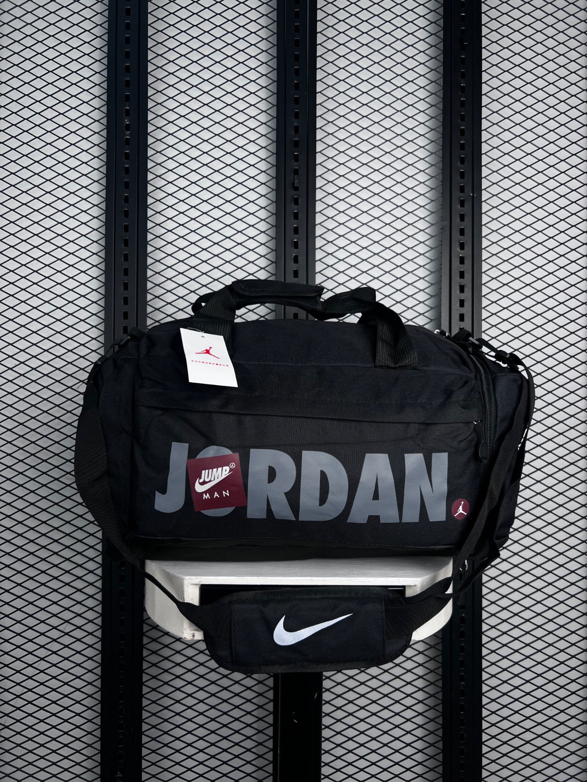 Duffel bag silhouette in black with grey typography