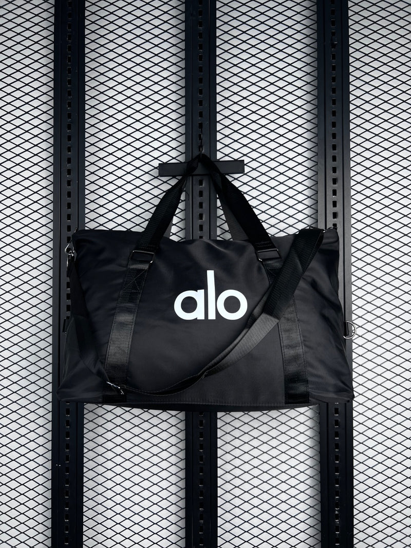 Black nylon duffle tote with webbing straps