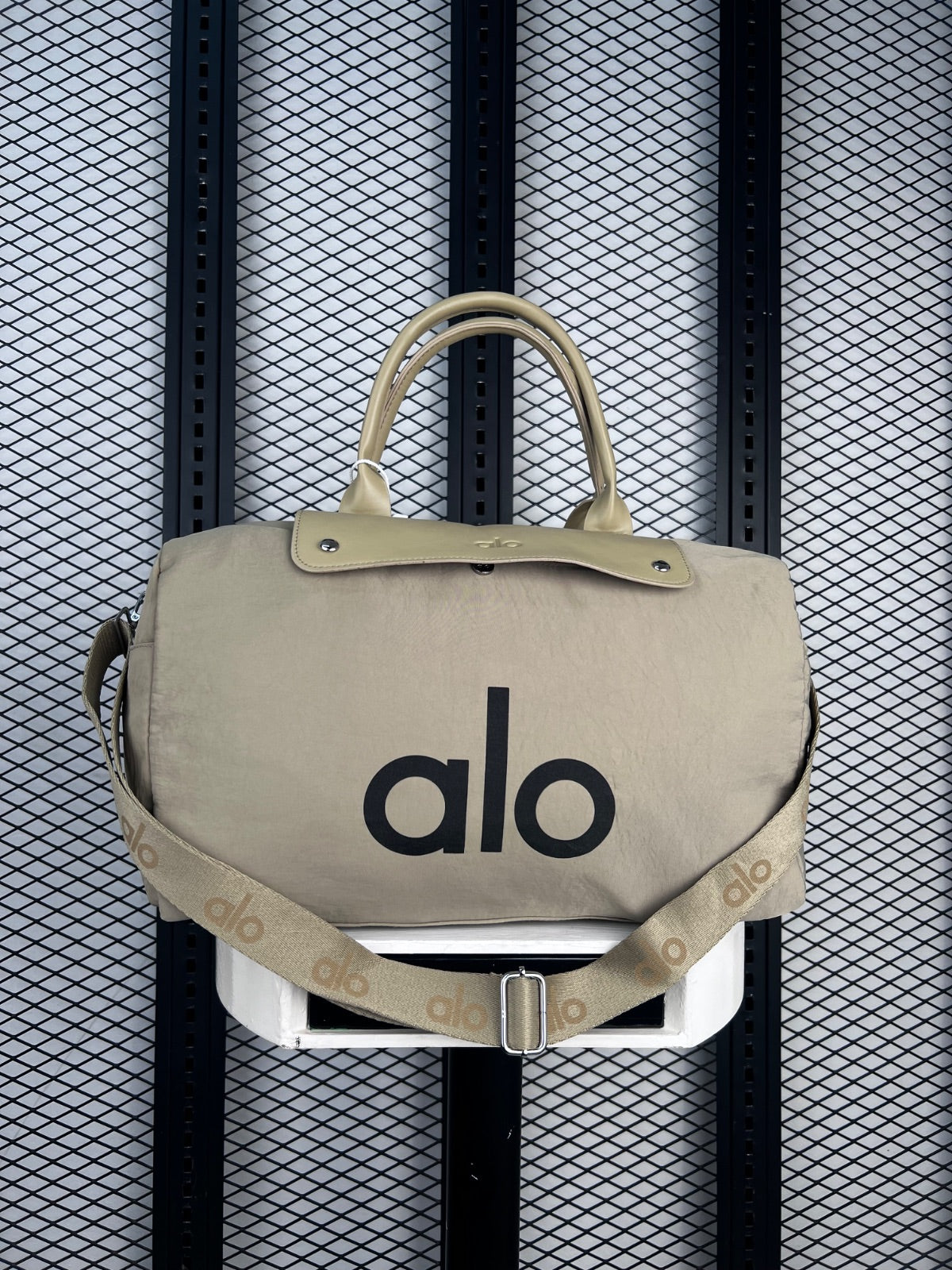 Crinkled nylon duffle with smooth flap closure
