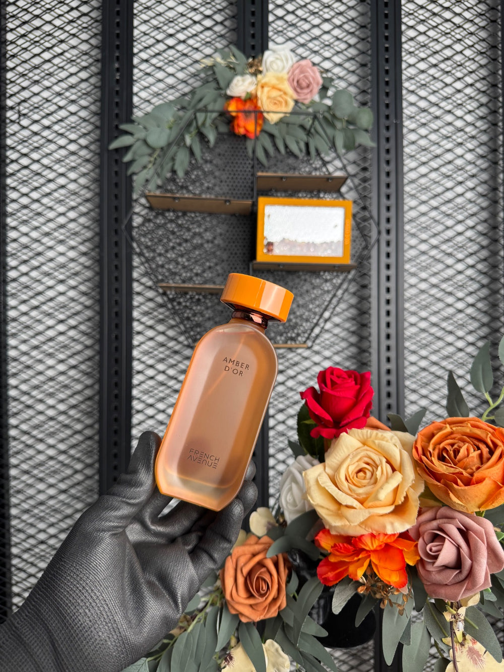 Glass-front boxed fragrance with loose amber stones