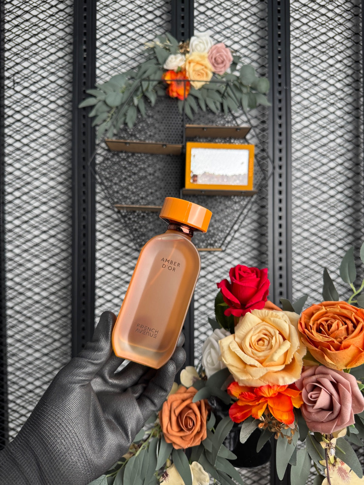Glass-front boxed fragrance with loose amber stones