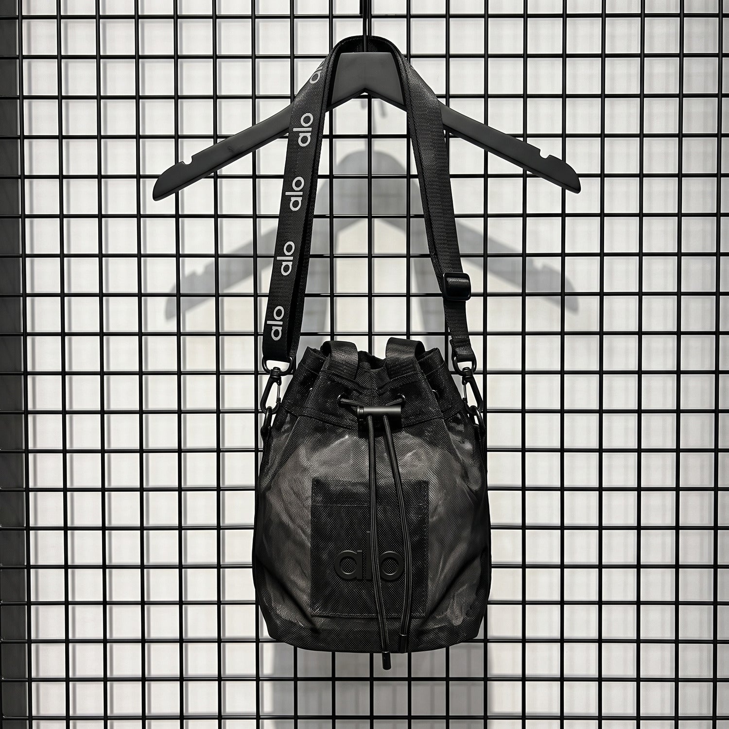 Nylon mesh drawstring bucket bag in black