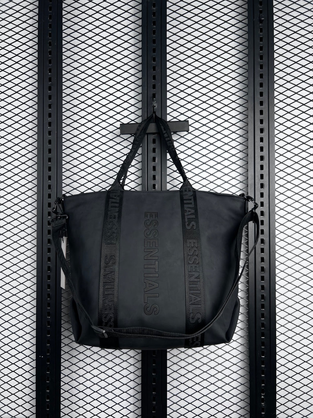 Embossed text matte black tote with jacquard webbing straps