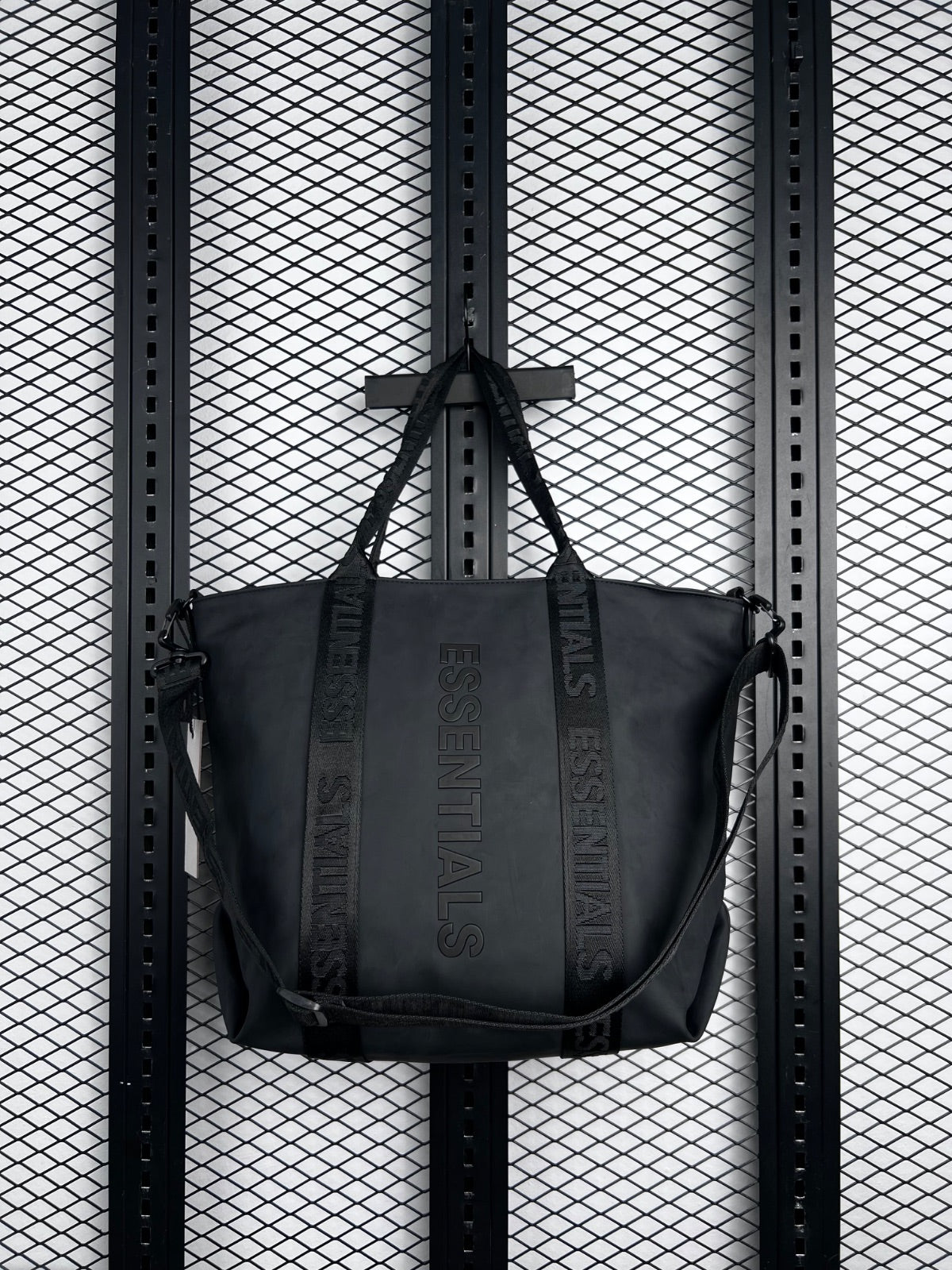 Embossed text matte black tote with jacquard webbing straps