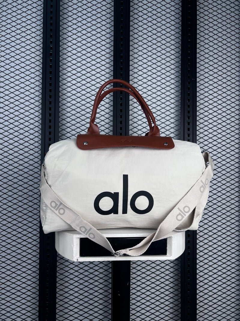 Canvas duffle bag with brown leather handles
