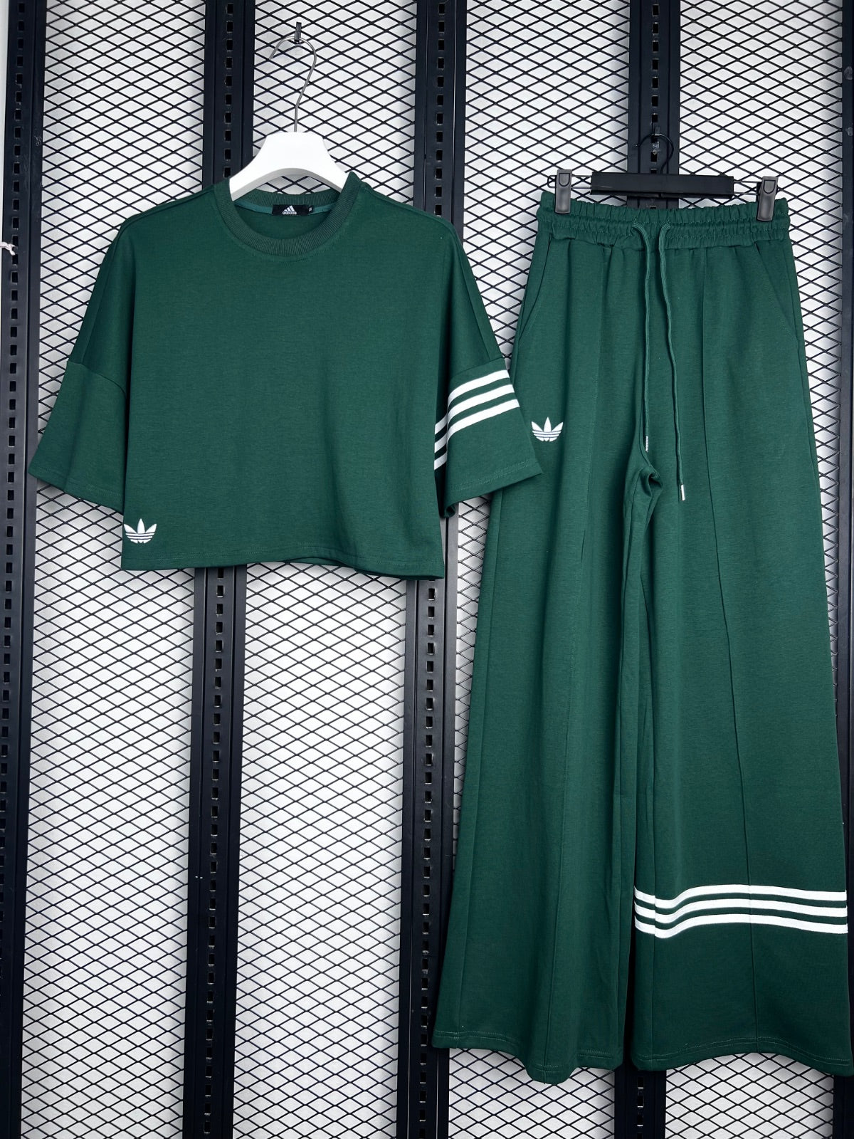 Matte forest green track set with striped cuff accents