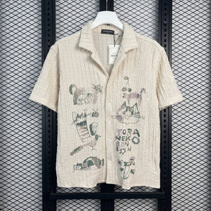 Short-sleeve camp-collar shirt in textured cream with cat sketches