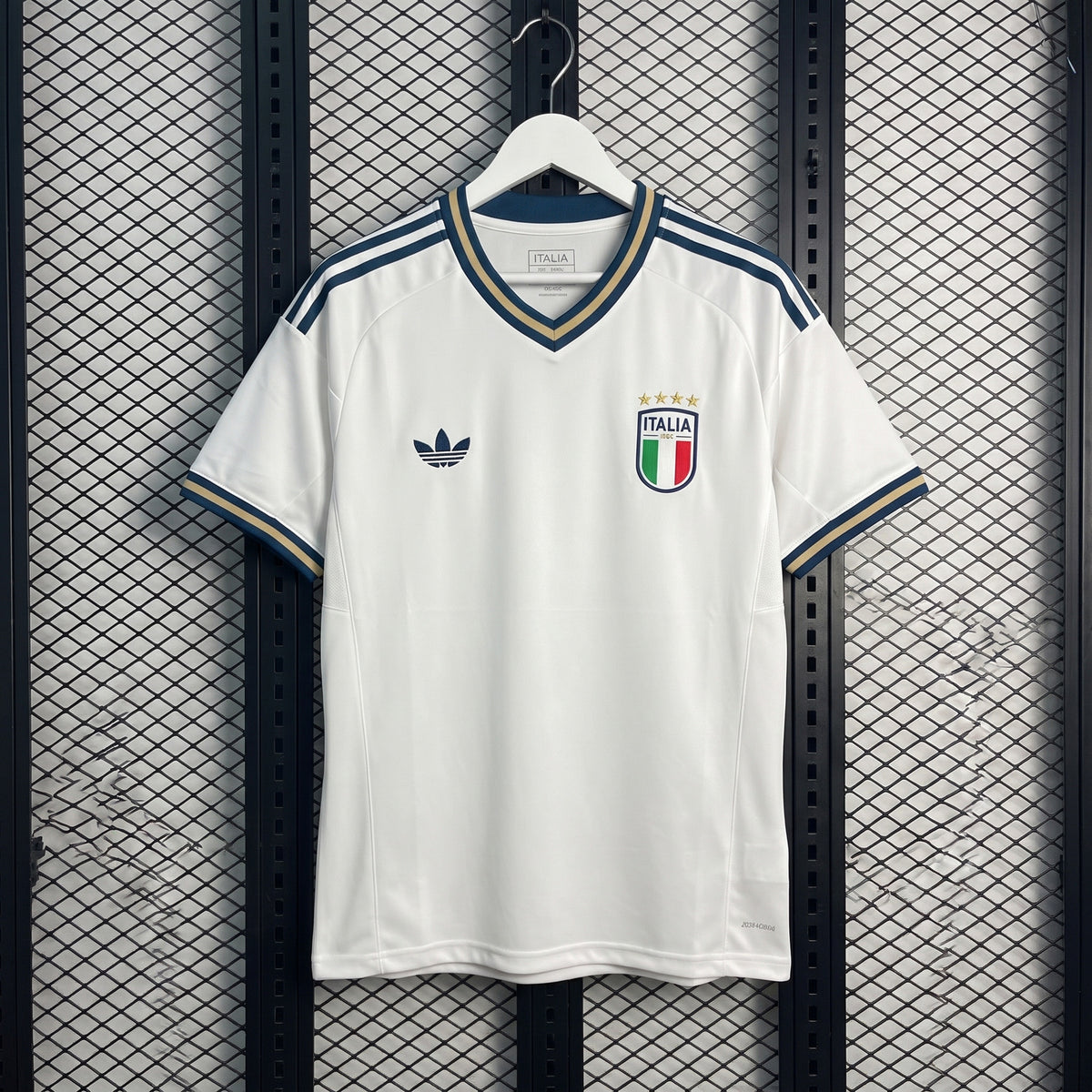 Matte white v-neck jersey with gold-trimmed navy accents