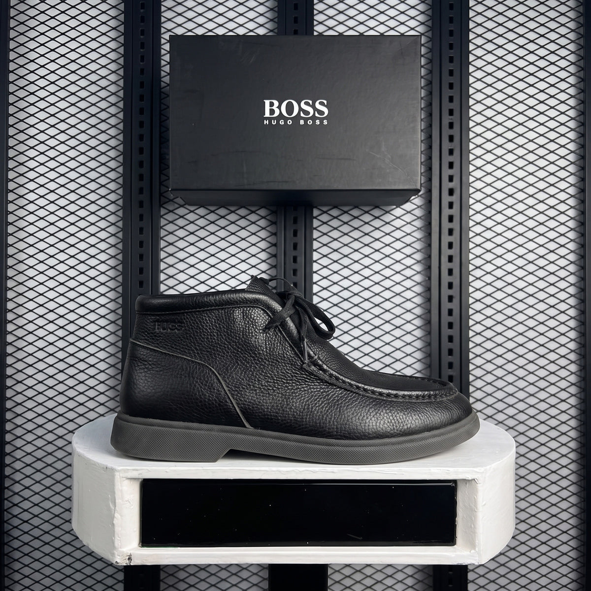 Moc-stitched pebbled leather ankle boot in black