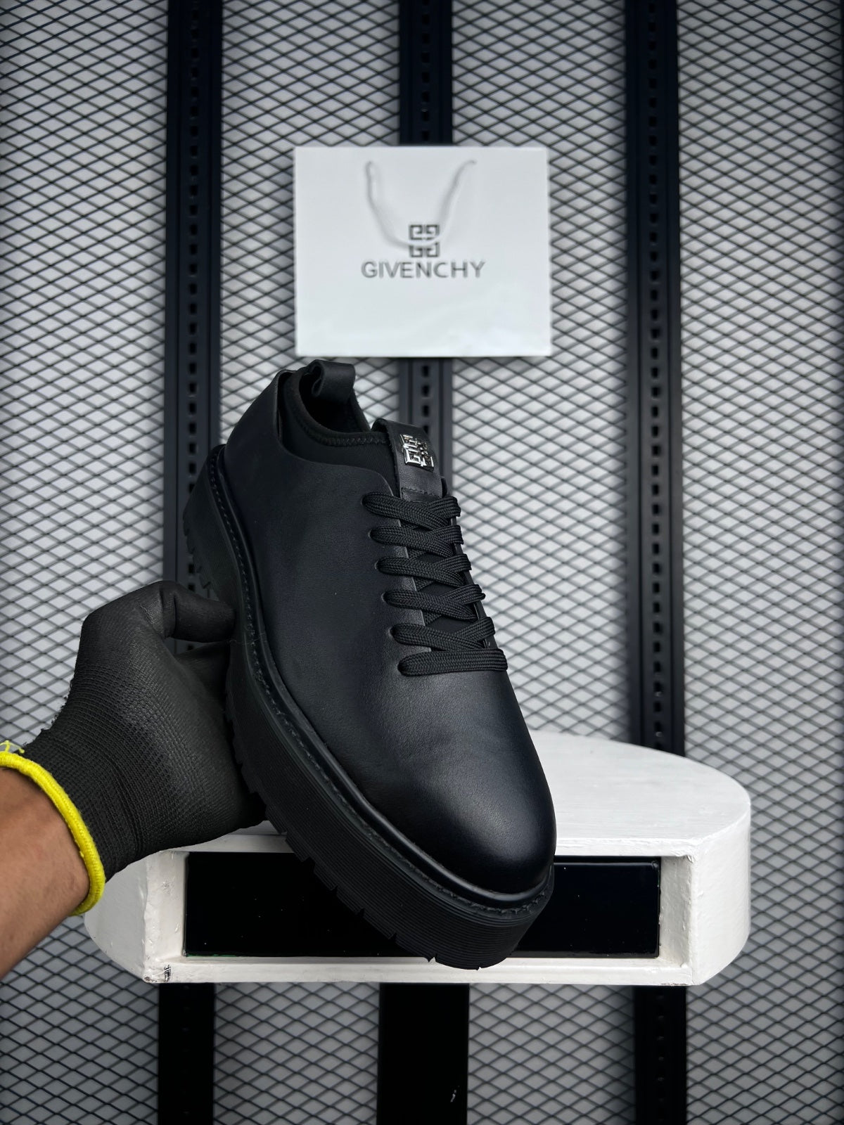 Matte black one-piece derby on a chunky lugged platform