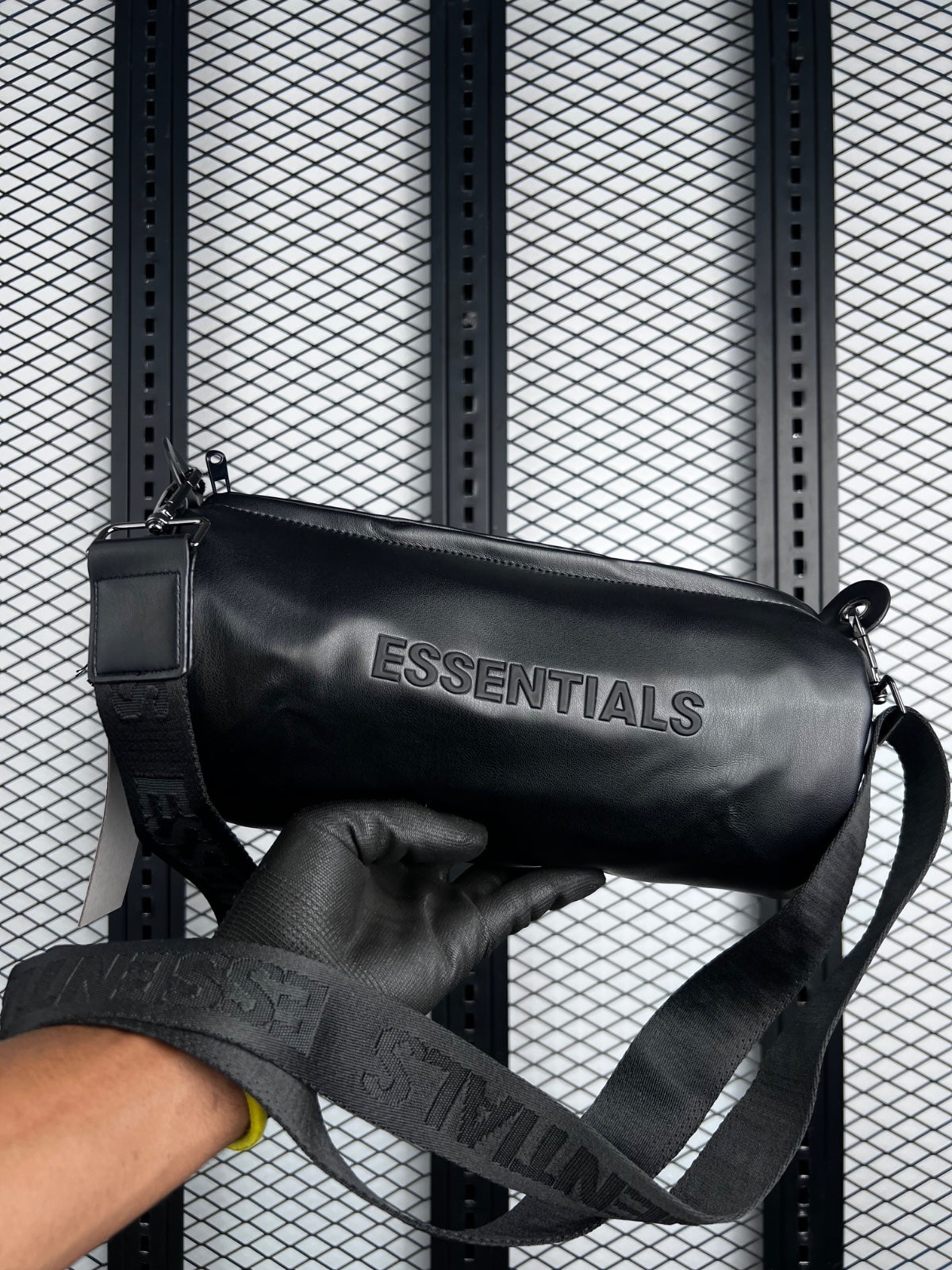 Smooth black leatherette cylindrical travel pouch