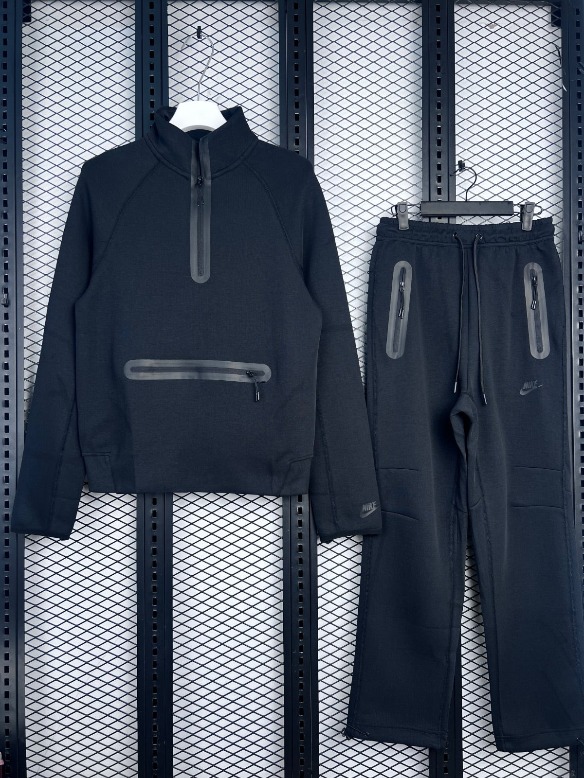 Black half-zip fleece tracksuit with taped zipper pockets