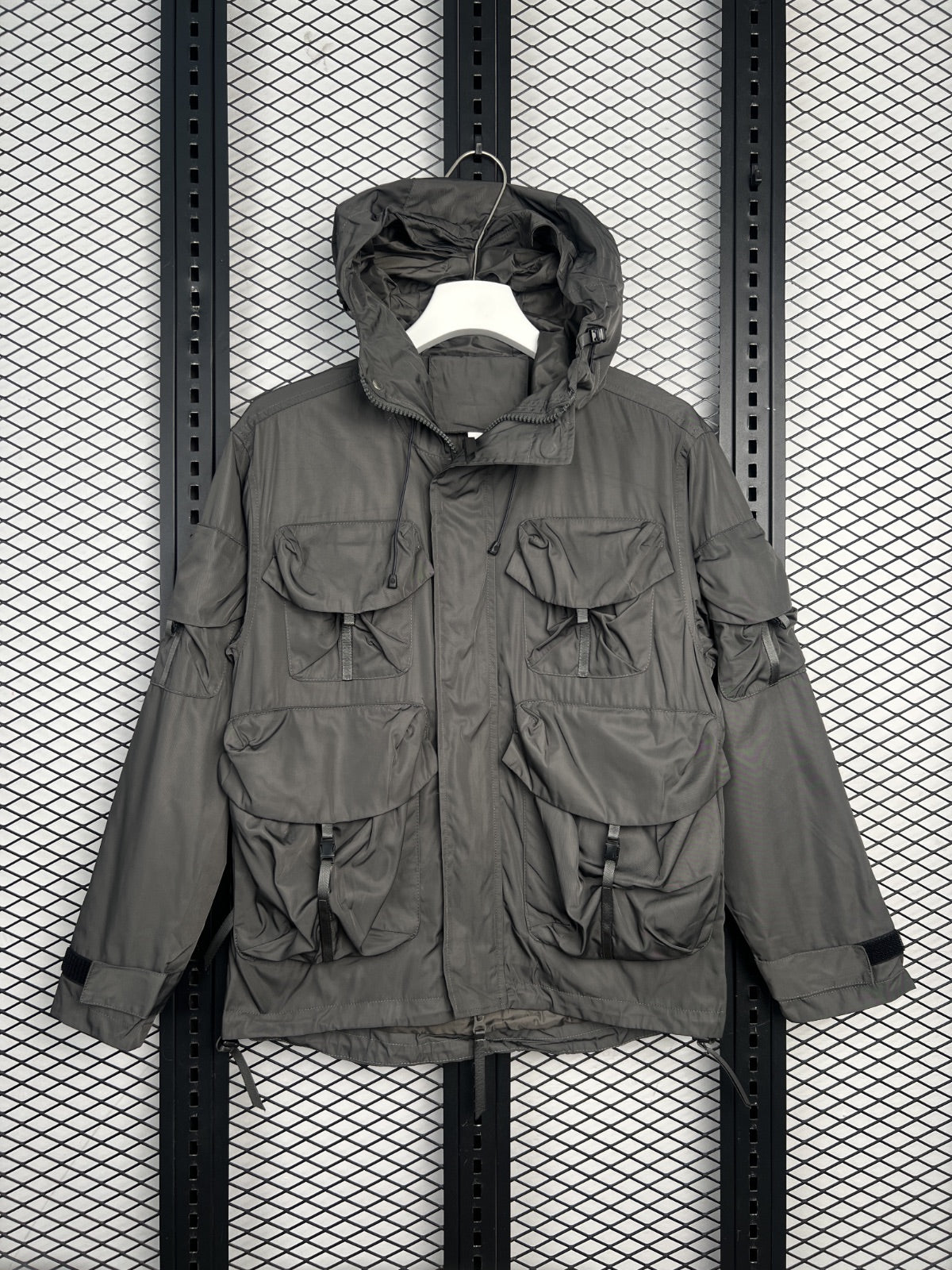 Olive drab multi-pocket hooded technical jacket