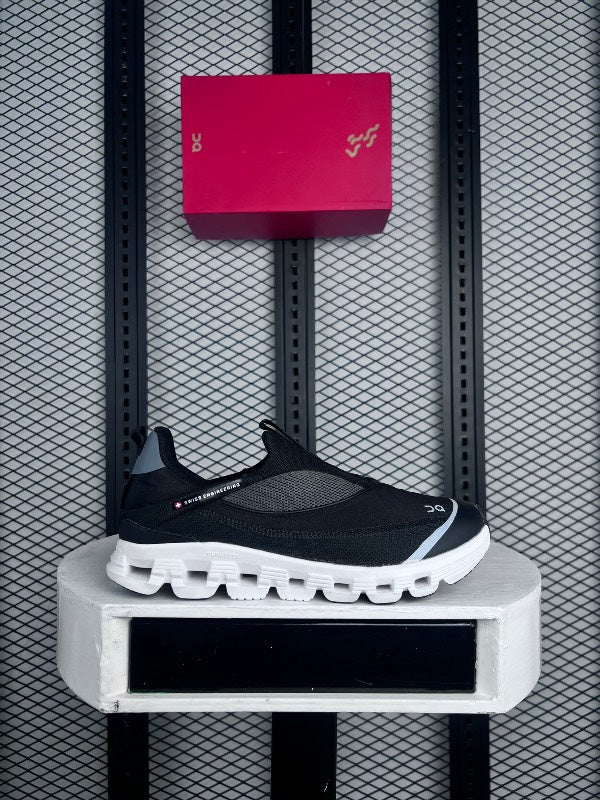 Textured textile runner in black and grey on a white cushioned sole