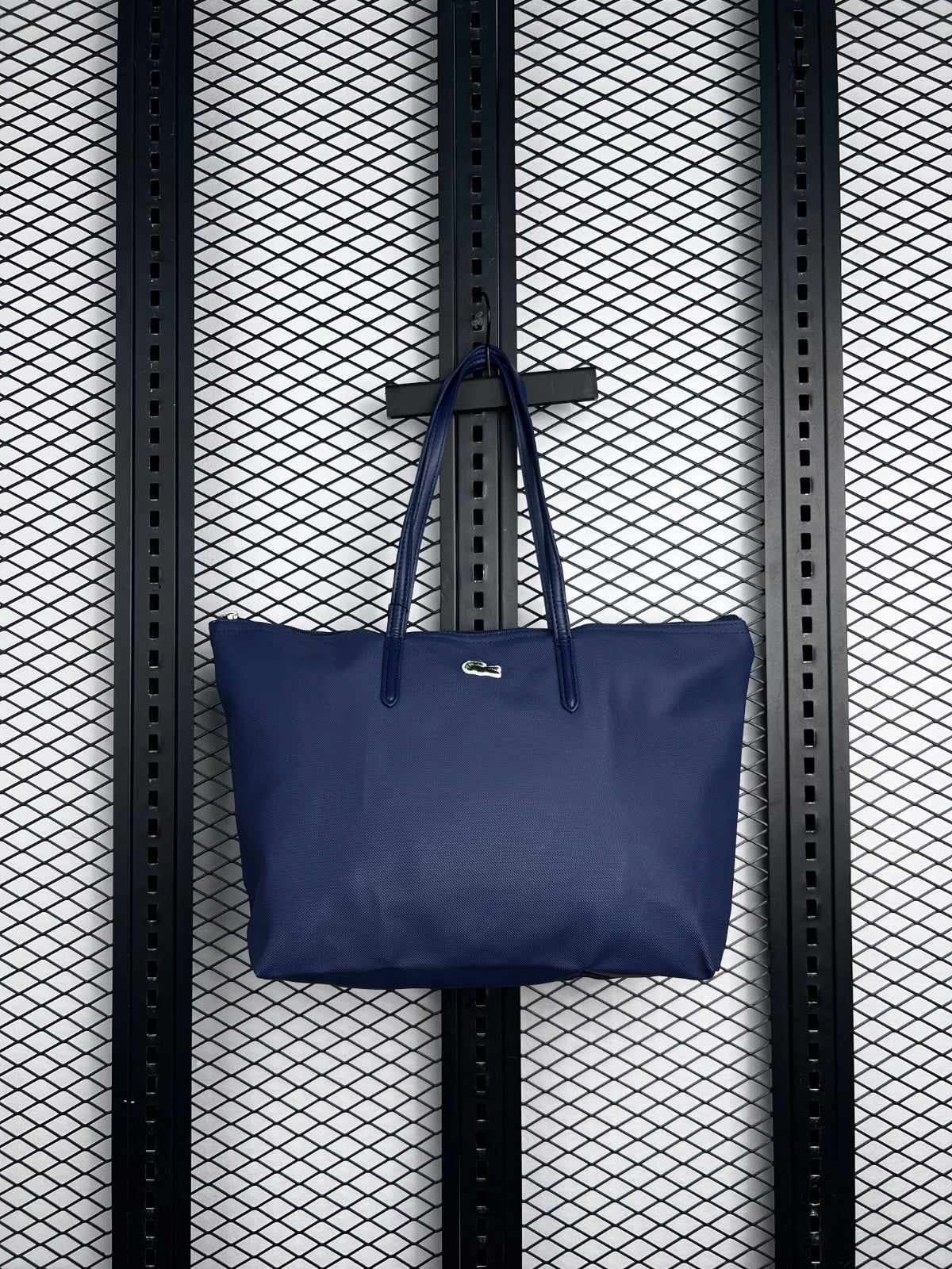 Navy textured zip tote with slender handles