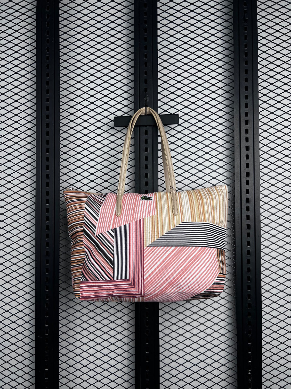 Textured coated canvas tote in multi-directional stripe patchwork