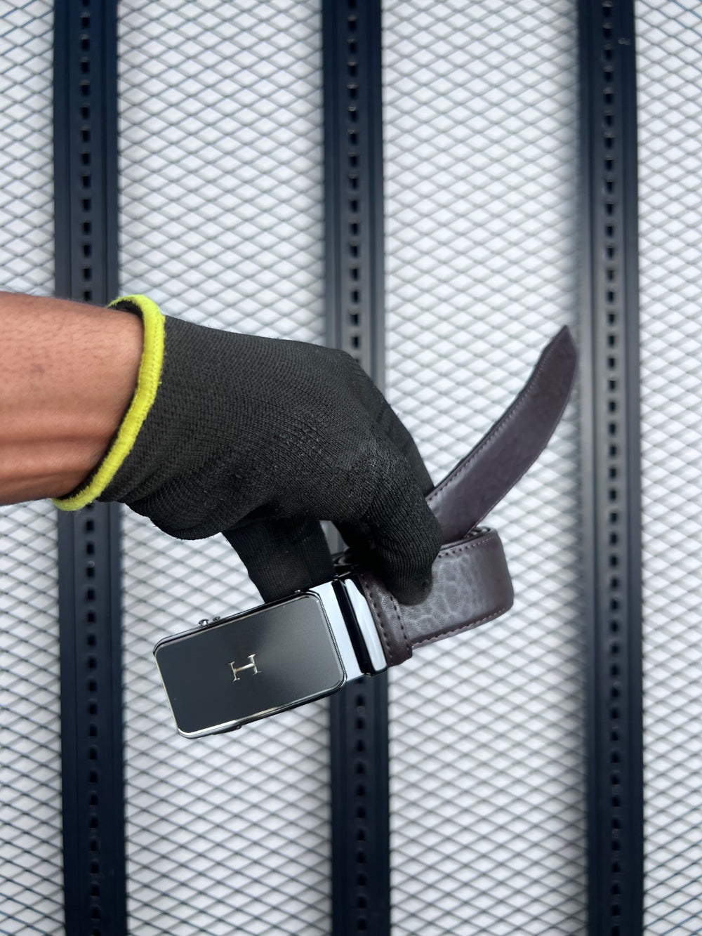 Black leather belt with initial plaque buckle