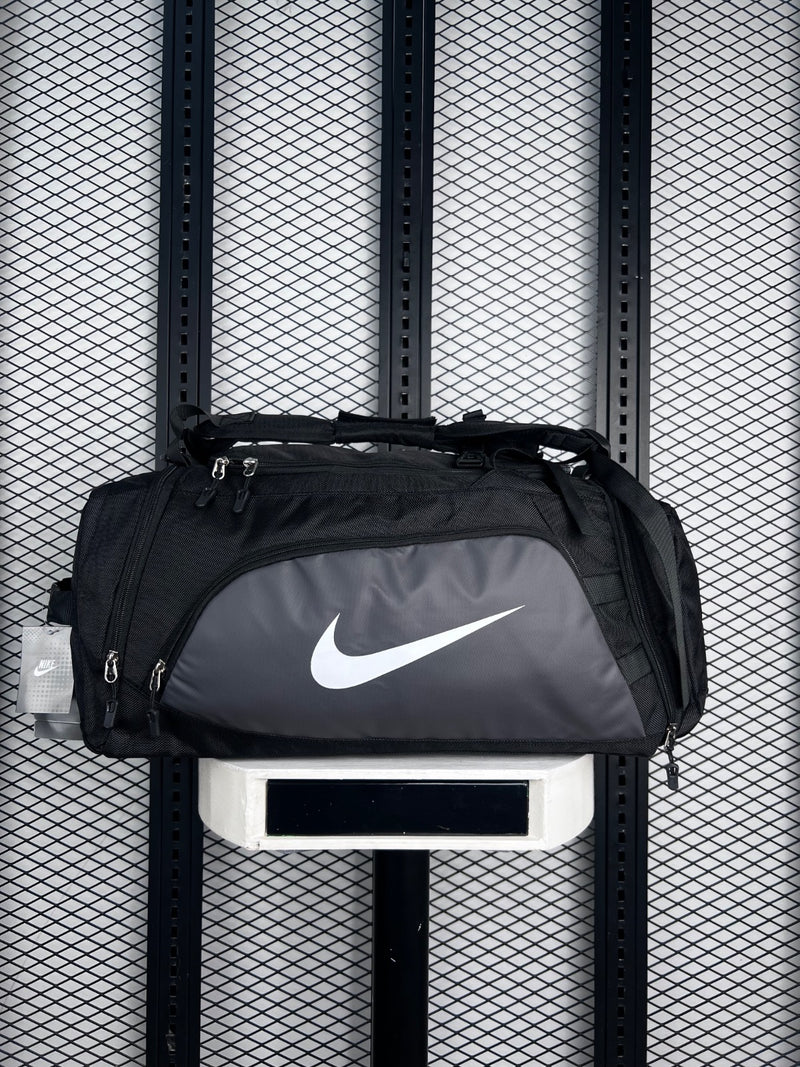 Black and charcoal two-tone duffel bag with front zip