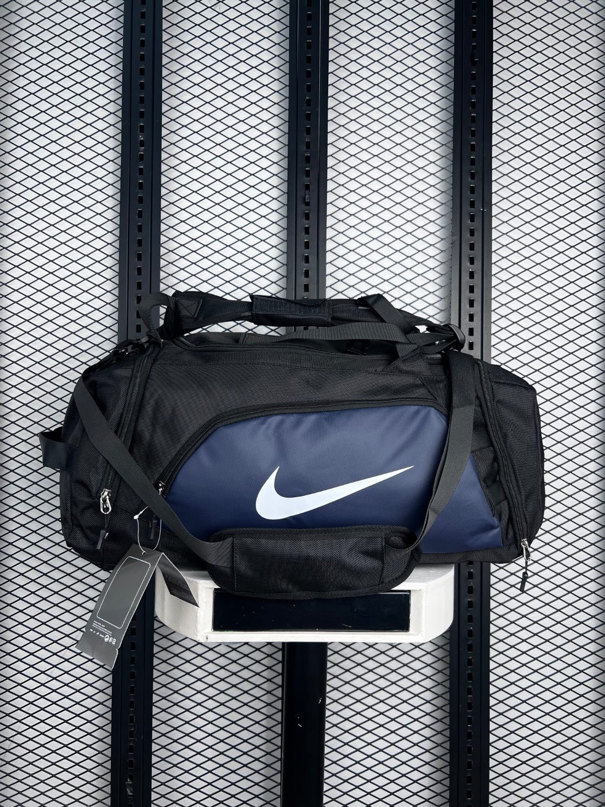 Webbed-strap duffel bag with navy front pocket