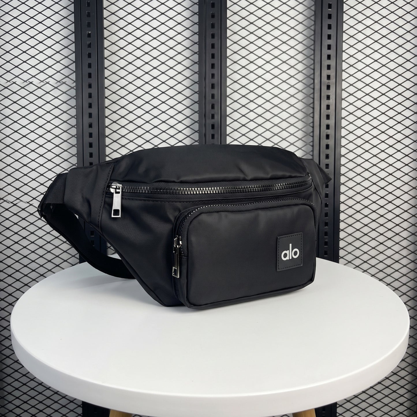 Black nylon belt bag with front zip pouch