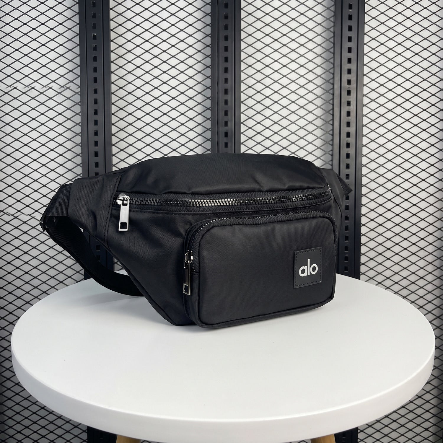 Black nylon belt bag with front zip pouch