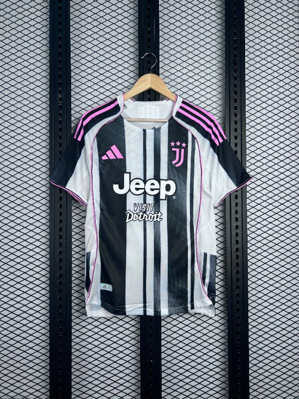 Pink-trimmed monochrome striped jersey with contrast chest graphics