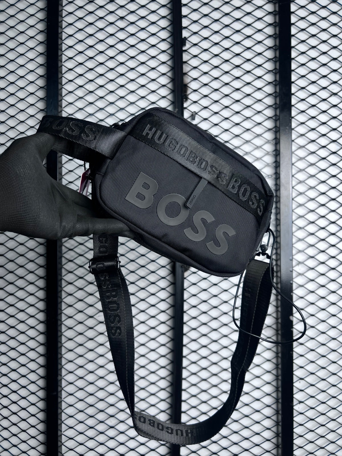 Zip-top nylon crossbody bag with woven webbing strap