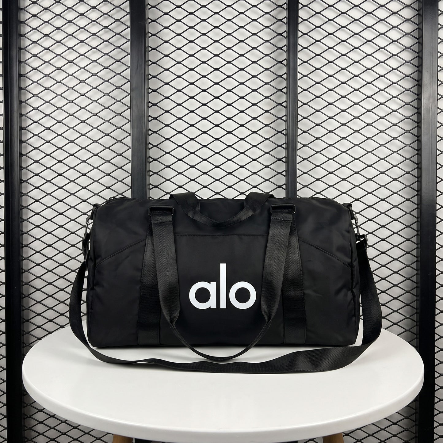 Front-pocket duffle bag with woven webbing straps