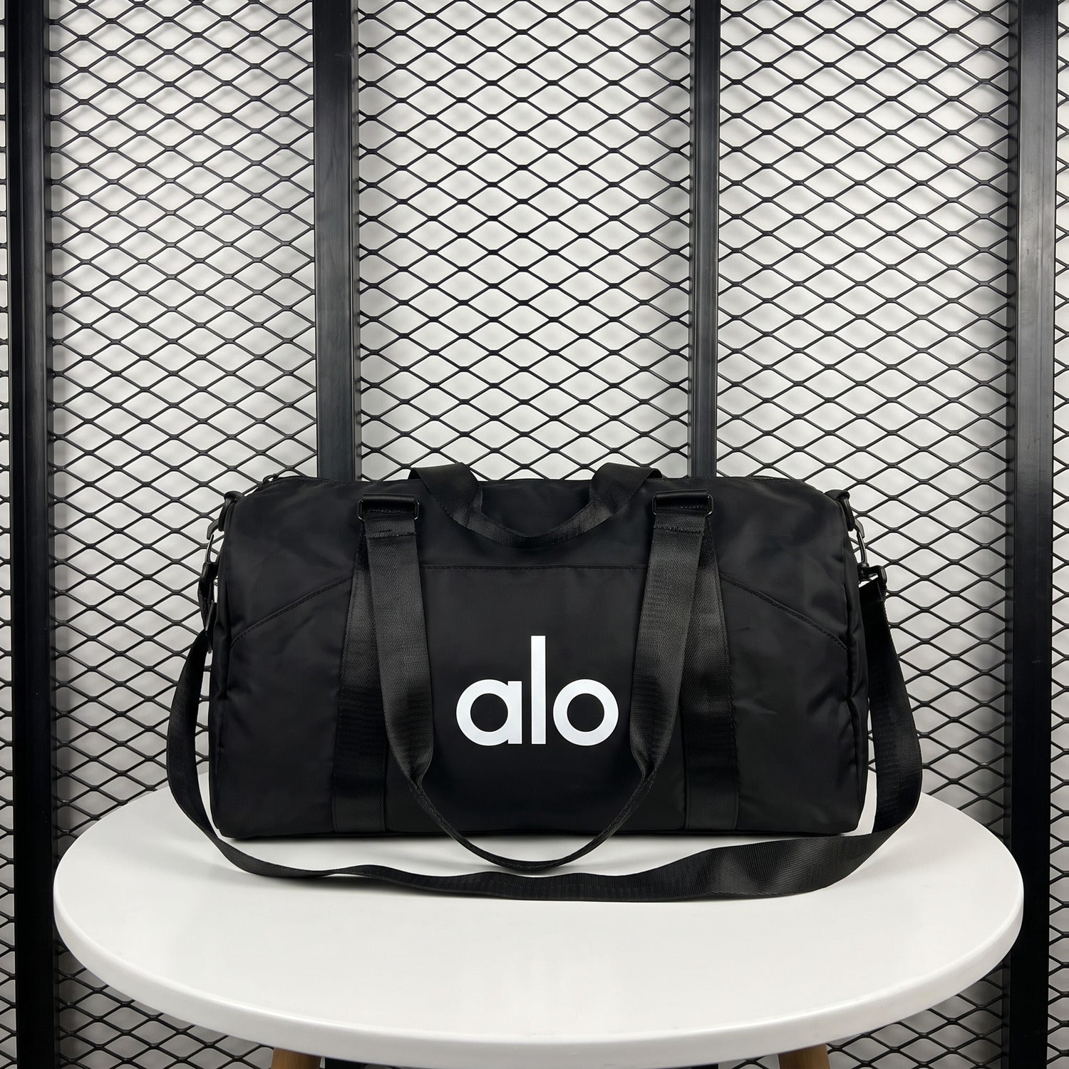 Front-pocket duffle bag with woven webbing straps