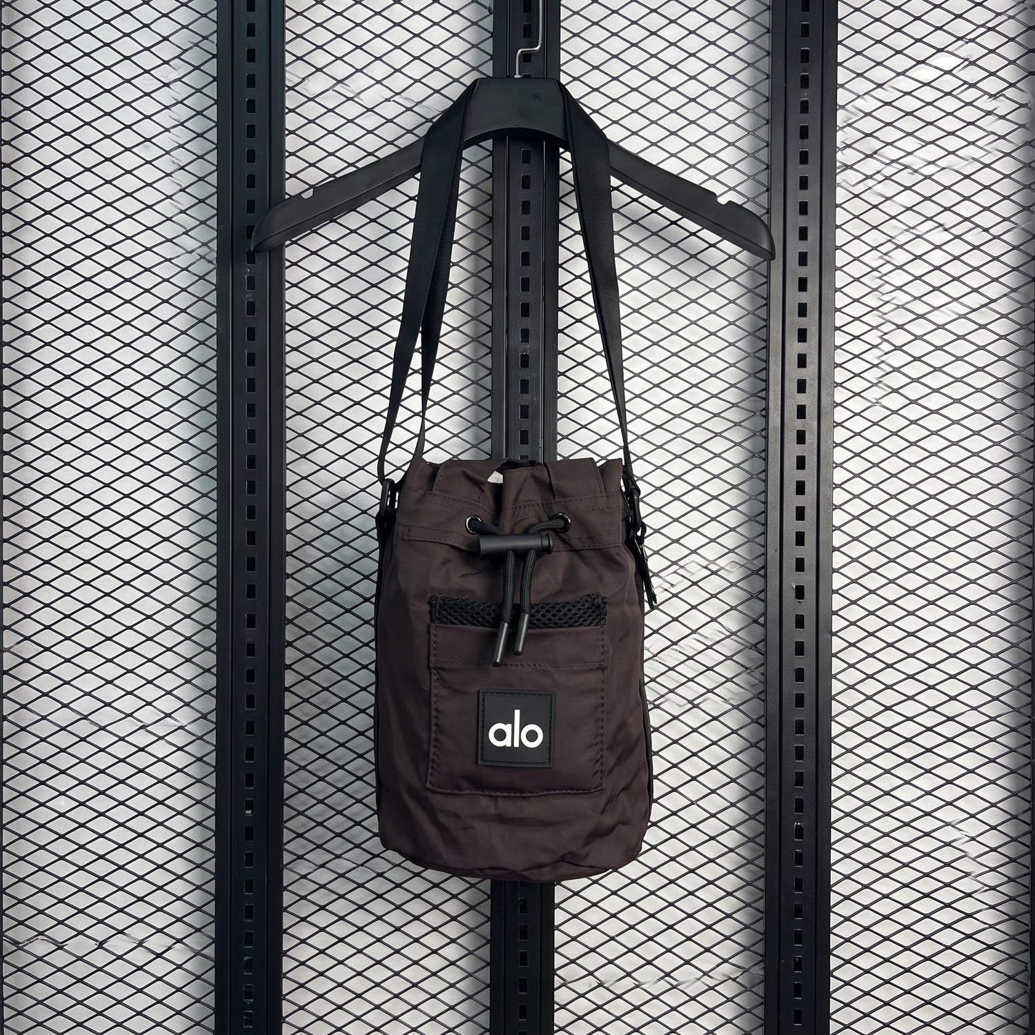 Mesh-pocket toggle crossbody bag in espresso nylon