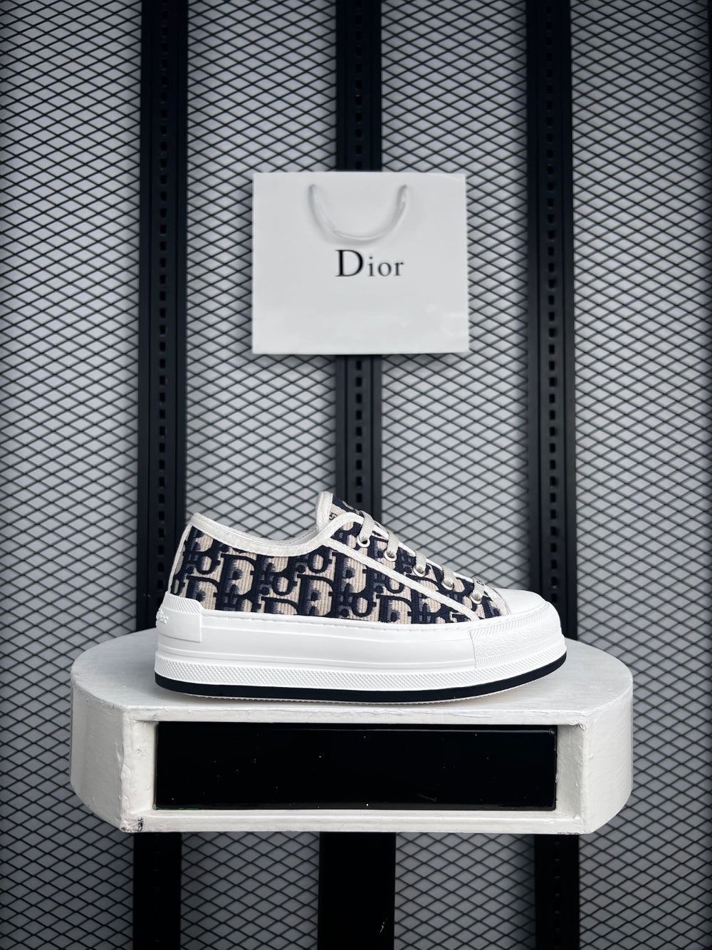 Platform low-top silhouette with navy monogram embroidery