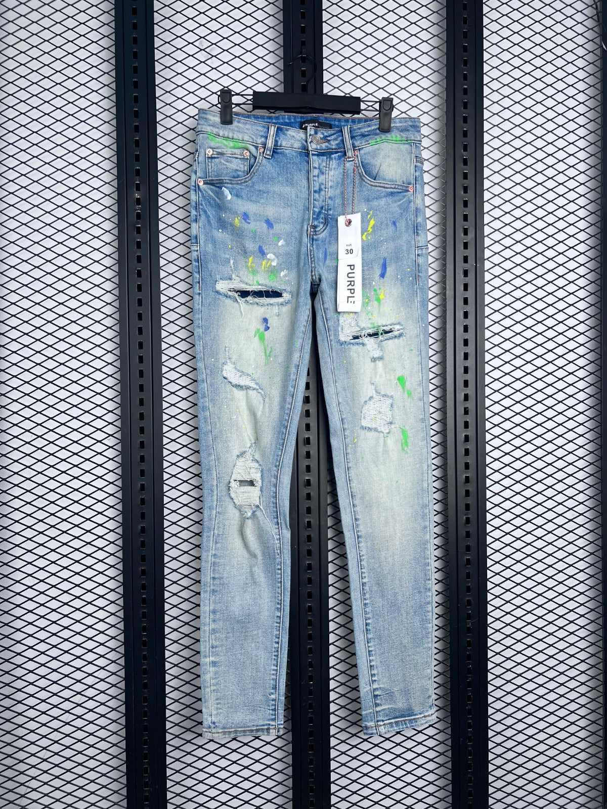 Paint-splatter distressed slim jeans in light wash denim