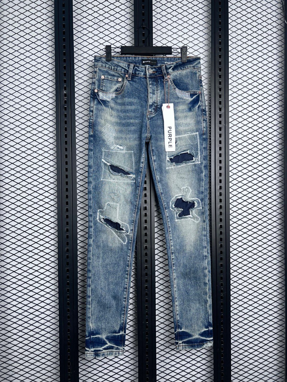 Patchwork distressed slim-fit jeans in washed blue denim