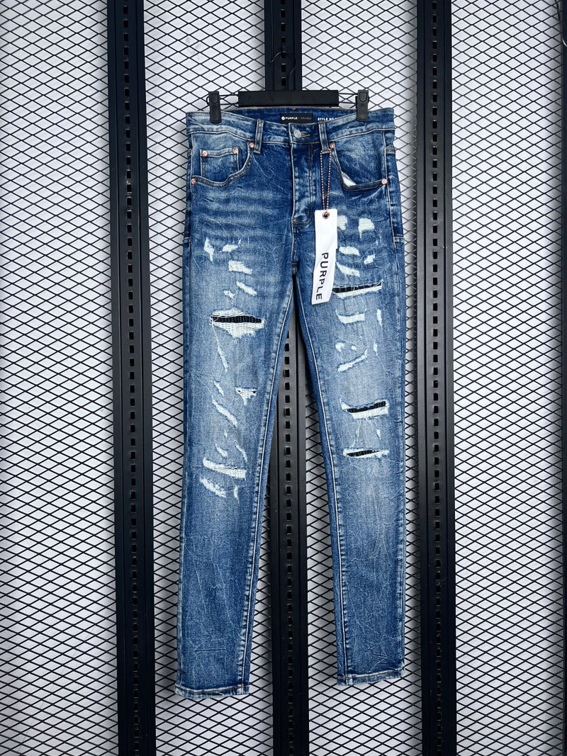 Distressed and ripped slim denim in washed blue
